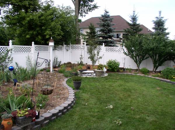 2005, very wide back shot of high corner garden, and side garden